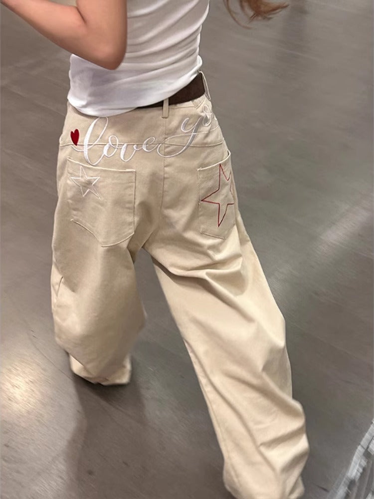 Pantaloni in denim a gamba larga ricamati