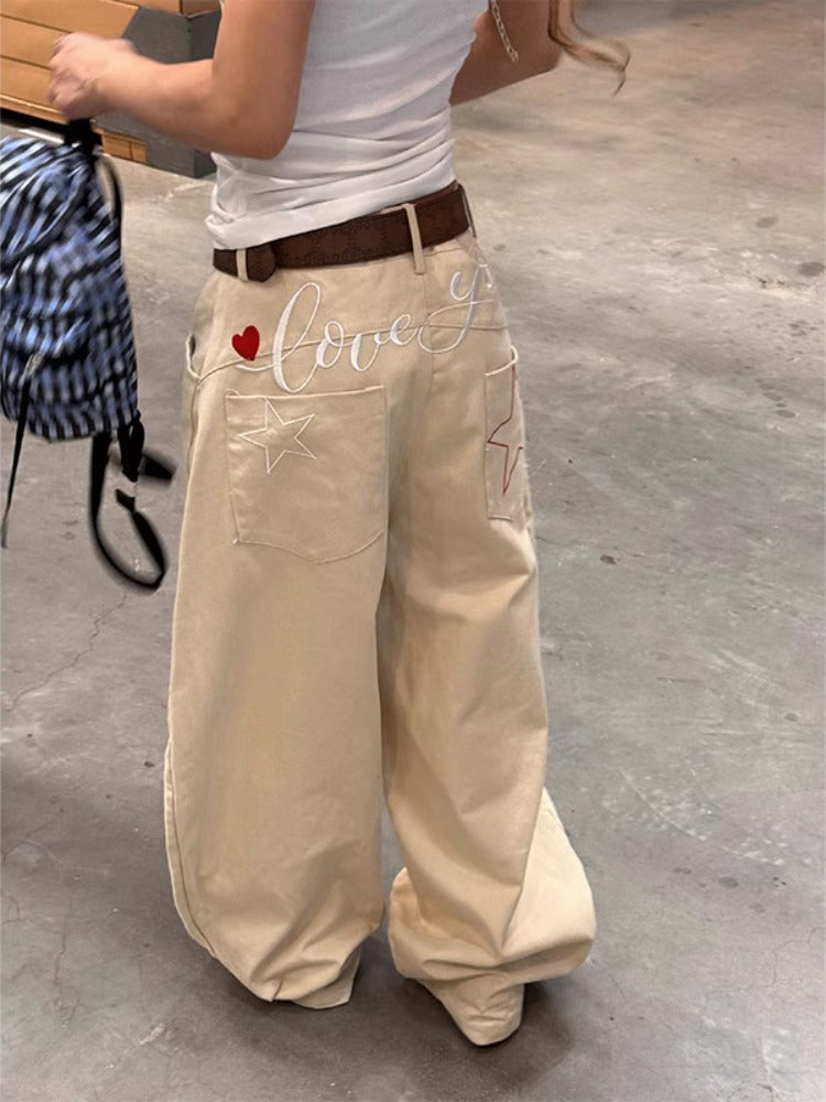 Jeans donna a gamba larga ricamati a vita alta