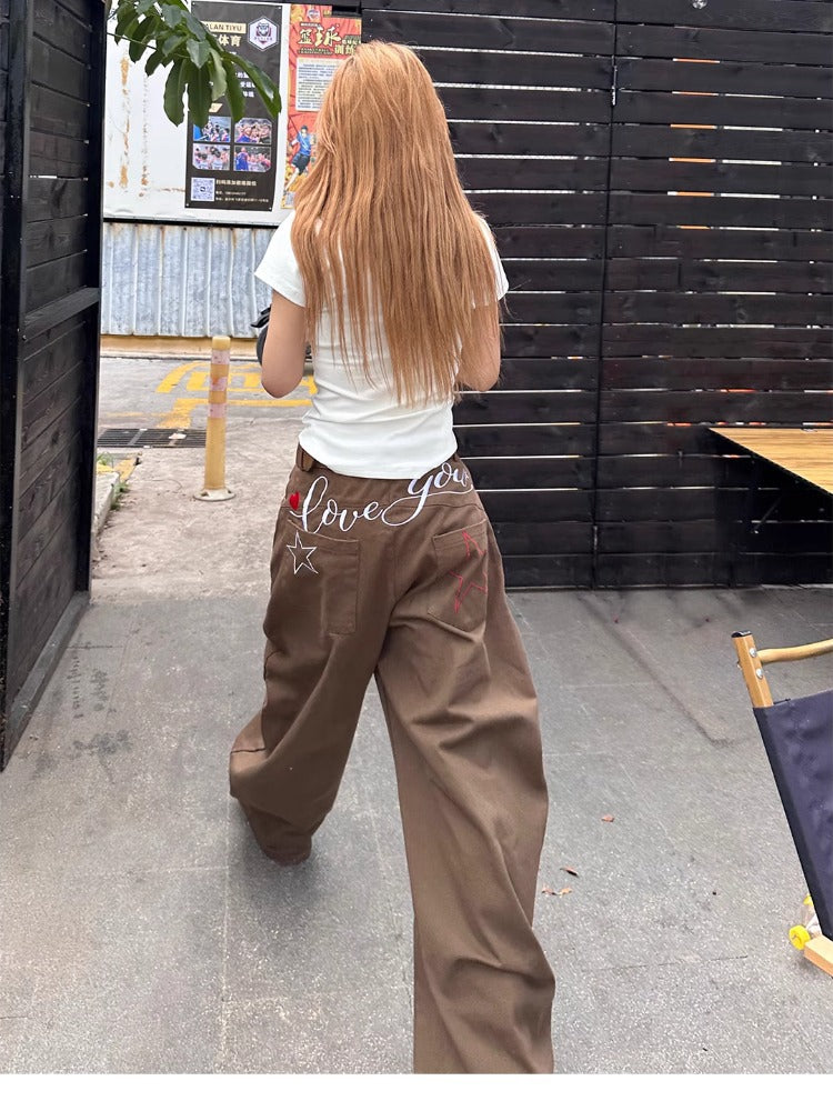 Jeans donna a gamba larga ricamati a vita alta