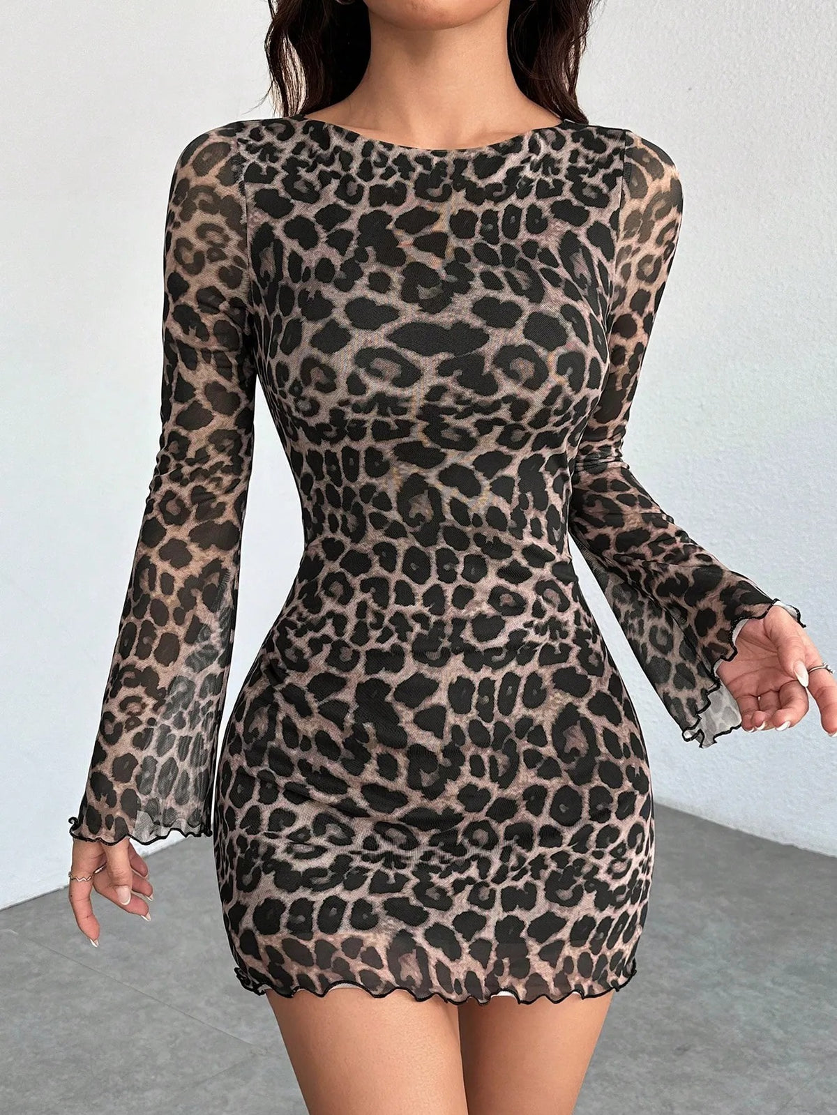 Abito da donna con inserti in rete e stampa leopardata